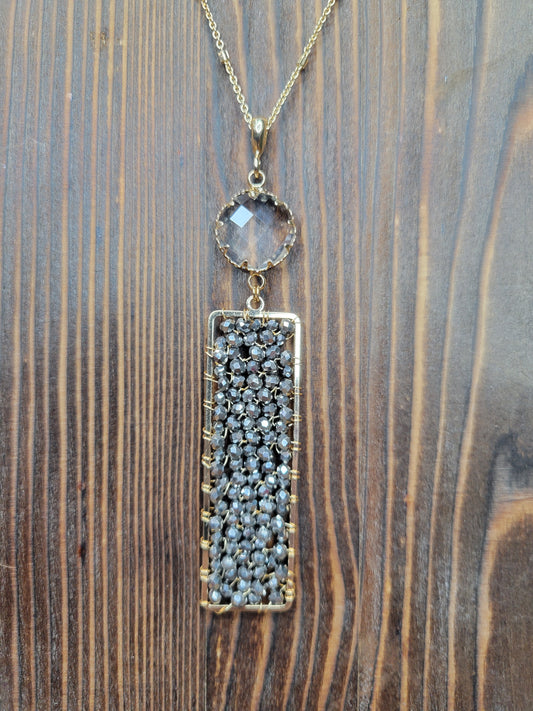 Gold Chain with a Charcoal Beaded Rectangle Pendant