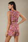 Gilli Sleeveless Surplice Waist Strap Floral Romper: Cream-Multi Floral